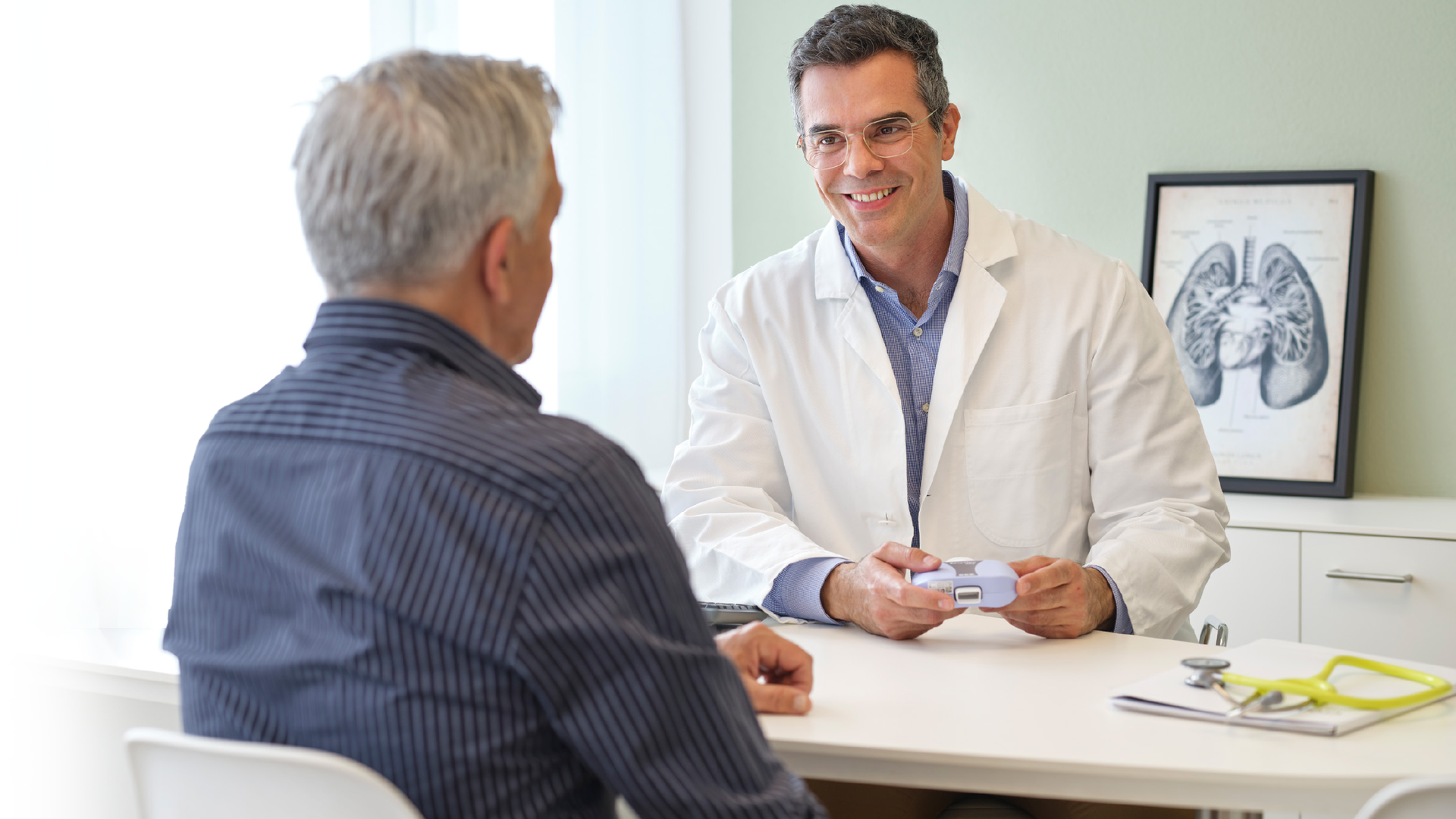 Doctor using an EasyOne spirometer