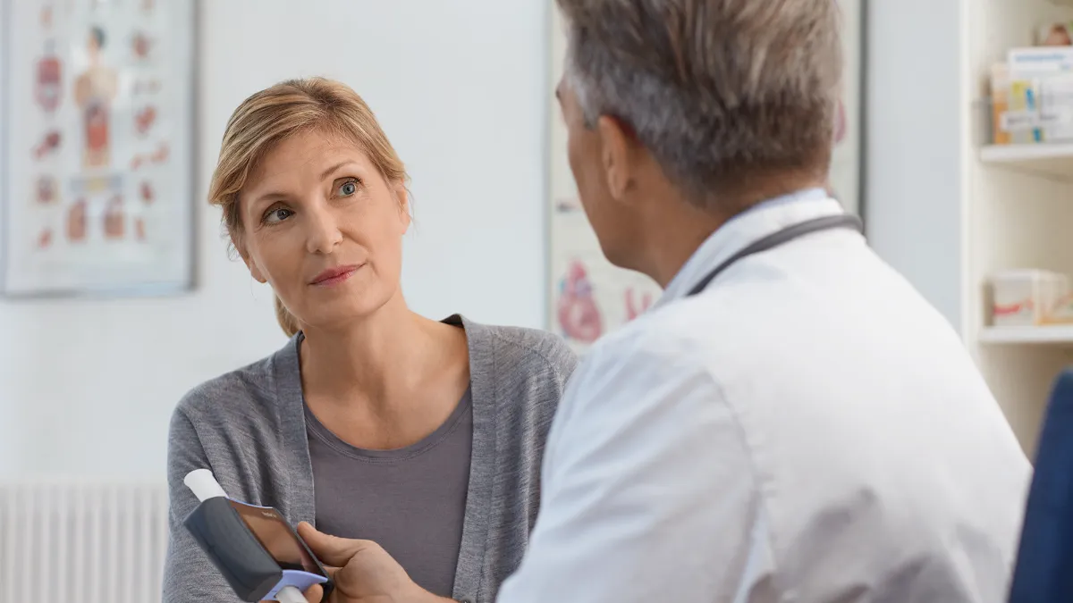 doctor talking to patient about asthma